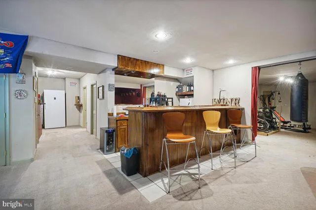 a bathroom with a sink toilet and mirror