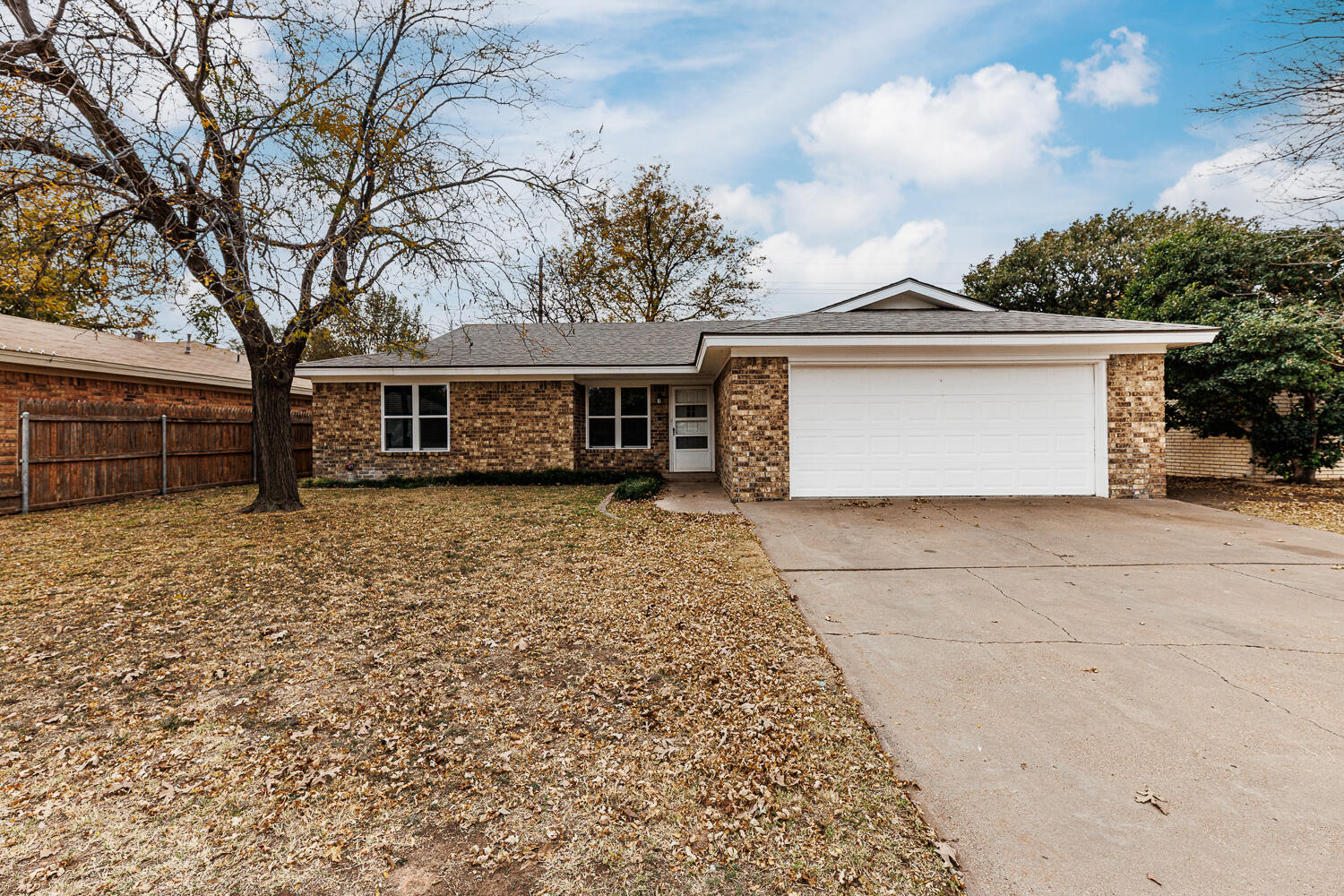 4813 73rd Street Lubbock, TX 79424 - Photo 1 of 49 front view of house with a yard