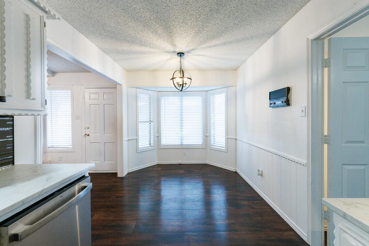 4813 73rd Street Lubbock, TX 79424 - Photo 13 of 49 wooden floor in an empty room with a window