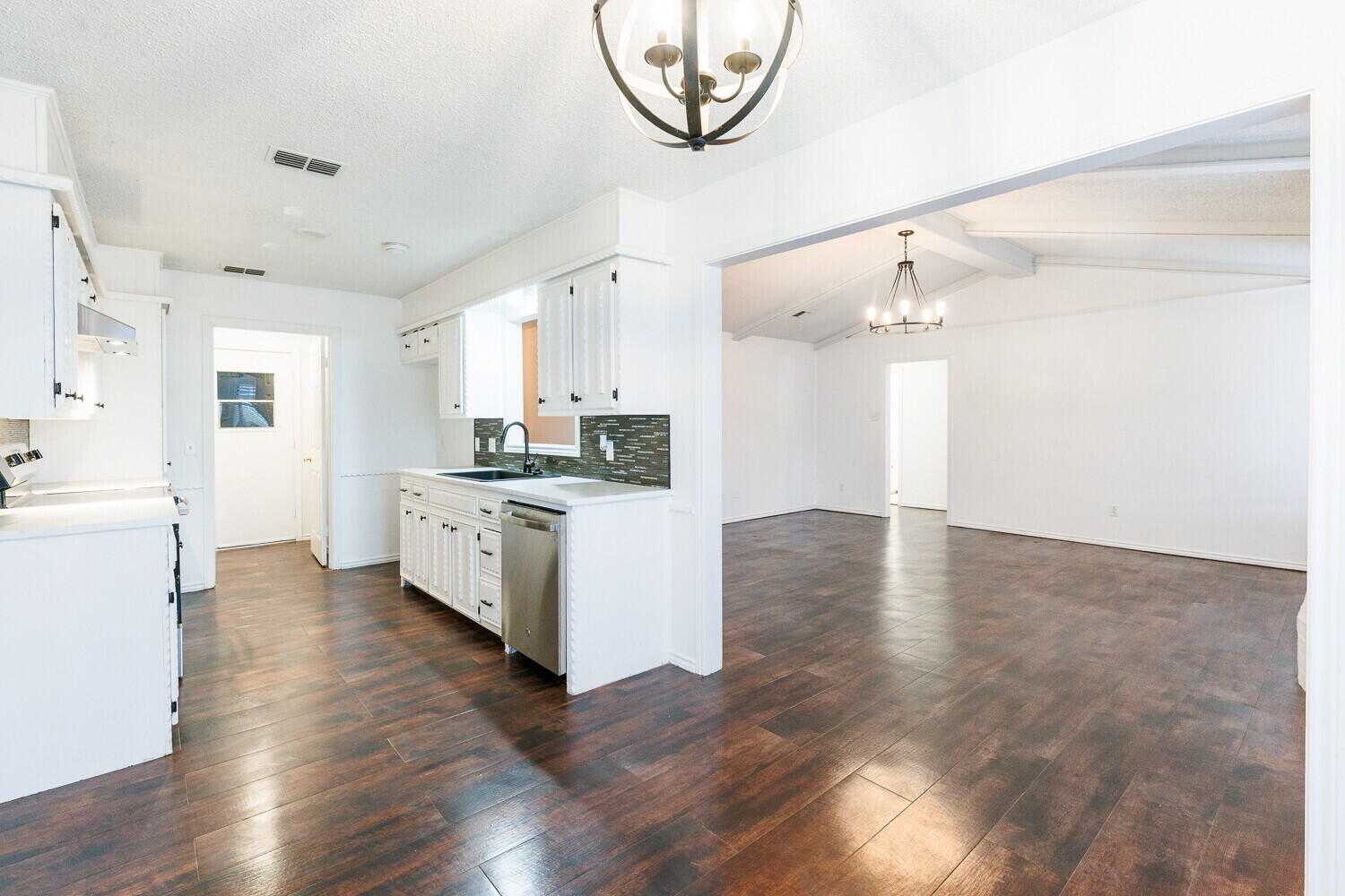 4813 73rd Street Lubbock, TX 79424 - Photo 14 of 49 a view of kitchen and hall with wooden floor