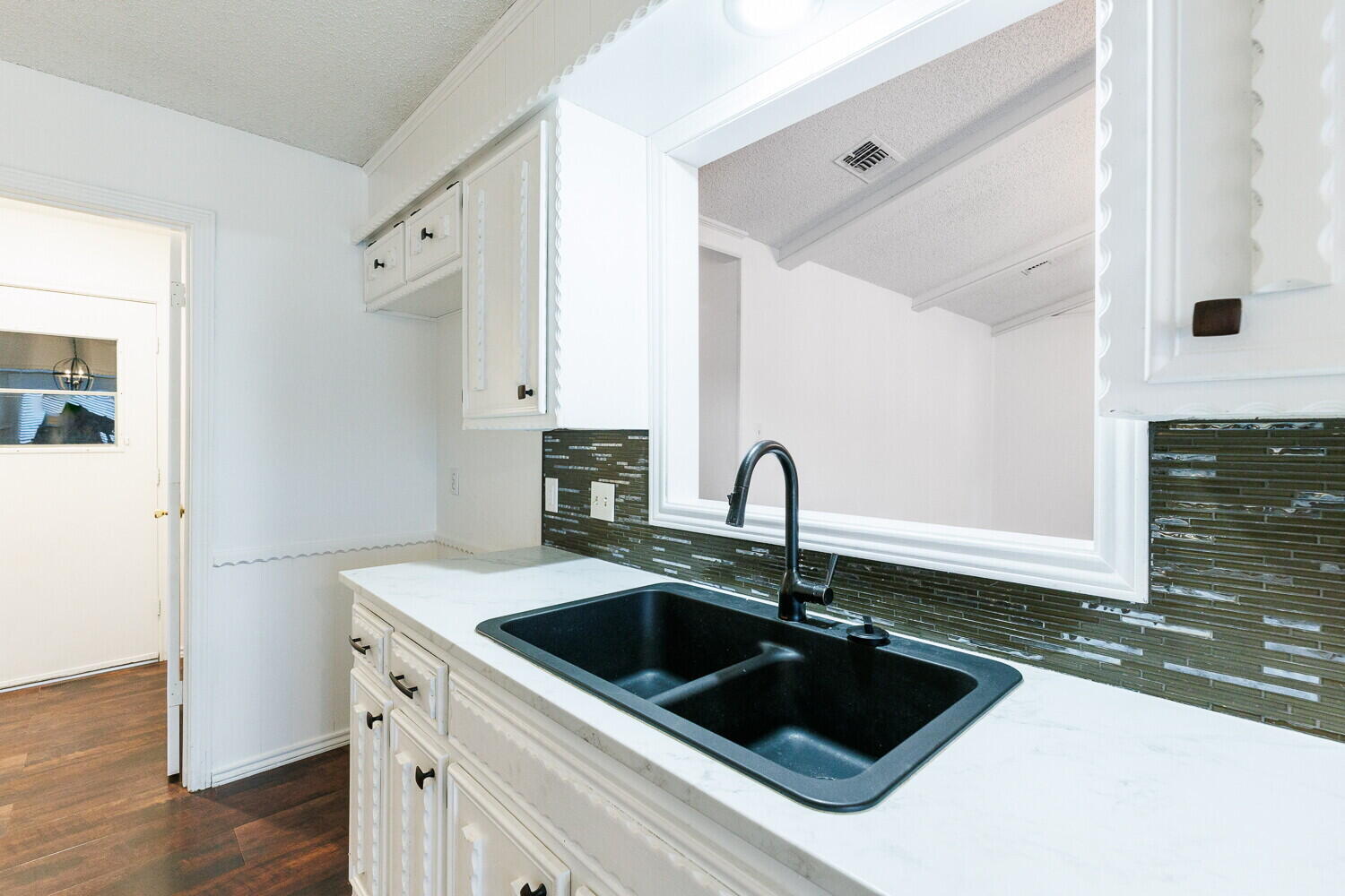 4813 73rd Street Lubbock, TX 79424 - Photo 17 of 49 a kitchen with a sink and a stove top oven