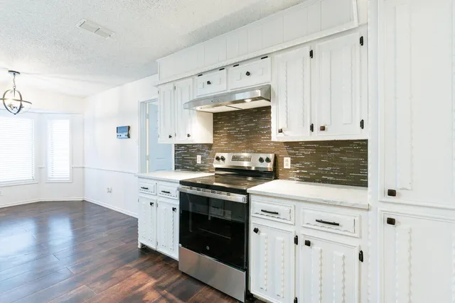 a bathroom with a sink and cabinets