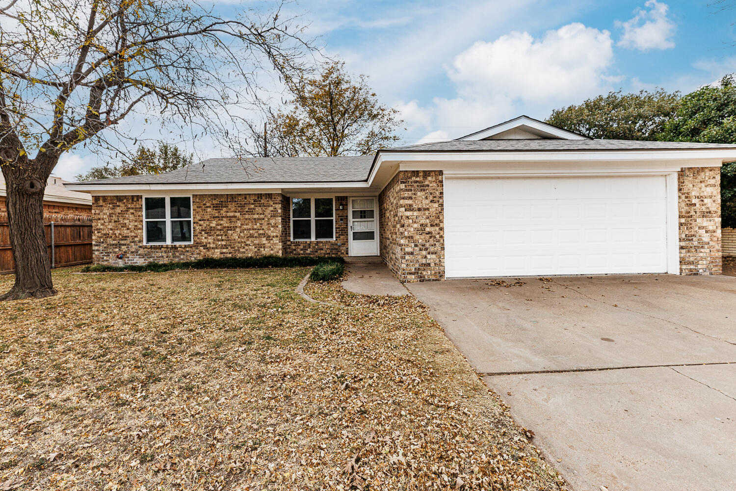 4813 73rd Street Lubbock, TX 79424 - Photo 2 of 49 front view of a house with a yard