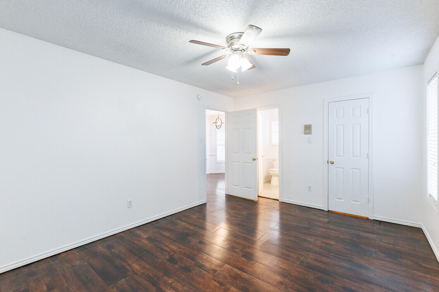 4813 73rd Street Lubbock, TX 79424 - Photo 22 of 49 an empty room with wooden floor and windows