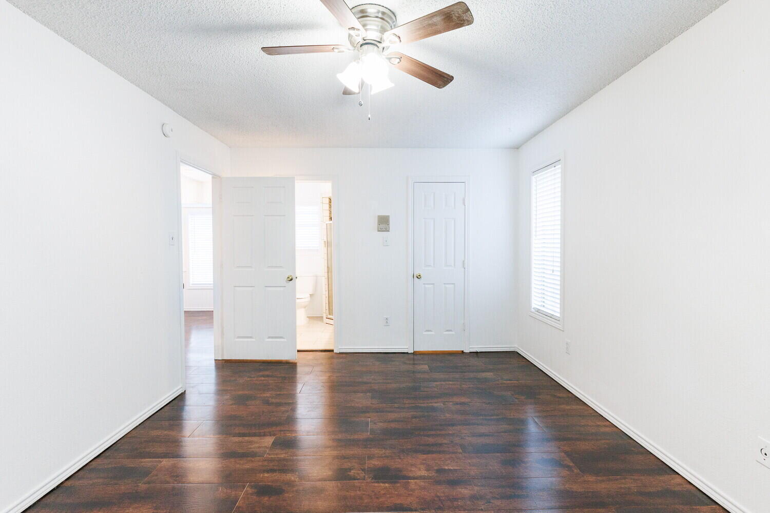 4813 73rd Street Lubbock, TX 79424 - Photo 23 of 49 a view of an empty room with wooden floor
