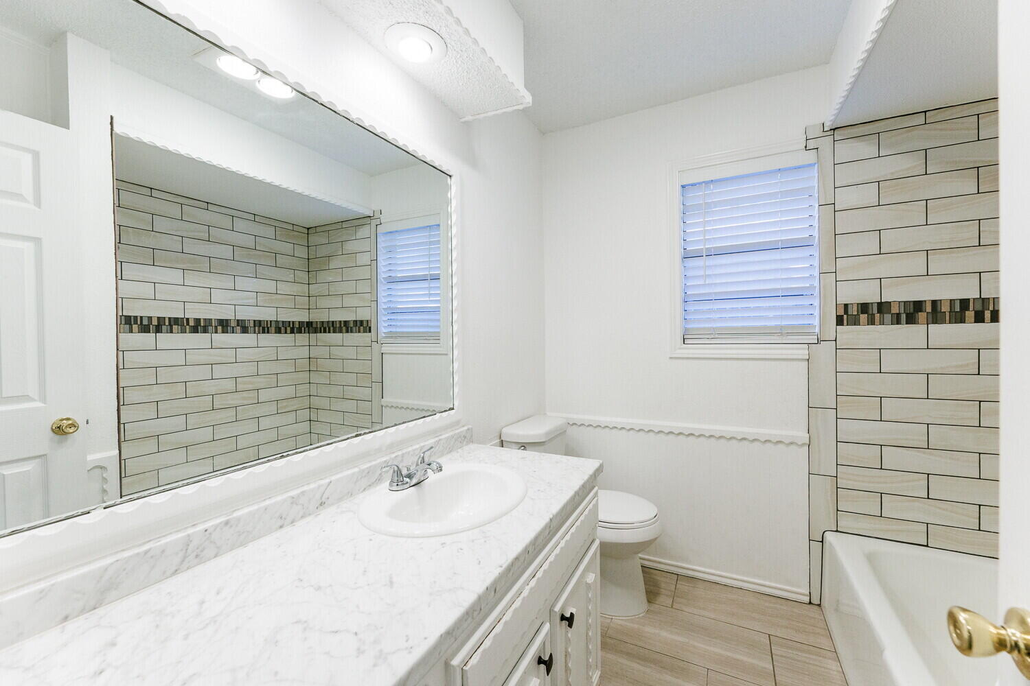 4813 73rd Street Lubbock, TX 79424 - Photo 33 of 49 a bathroom with a sink and a toilet