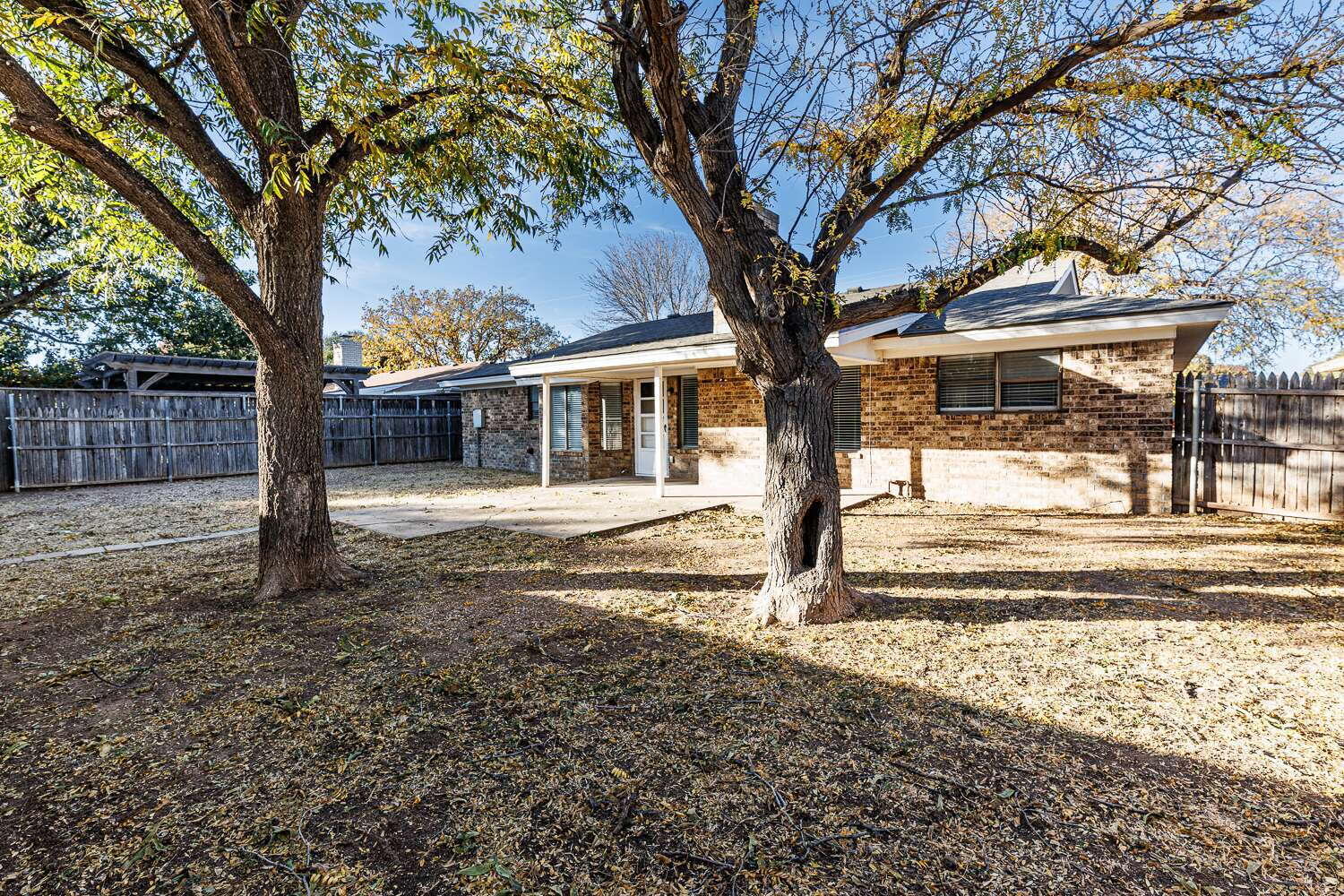 4813 73rd Street Lubbock, TX 79424 - Photo 45 of 49 a view of a house with a tree in the yard