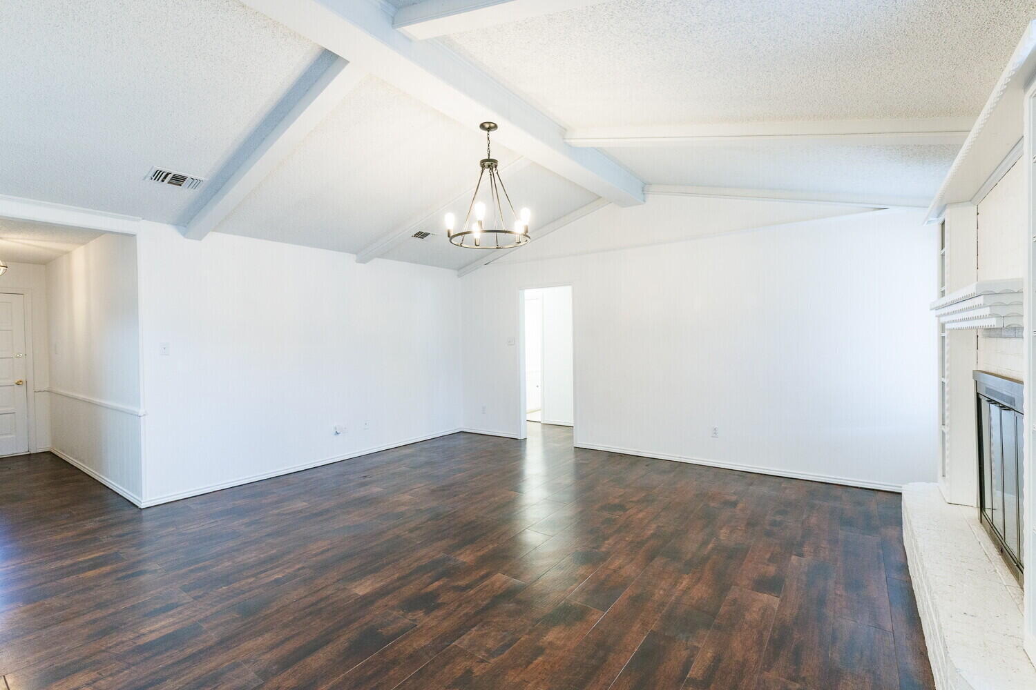 4813 73rd Street Lubbock, TX 79424 - Photo 8 of 49 wooden floor in an empty room with a window