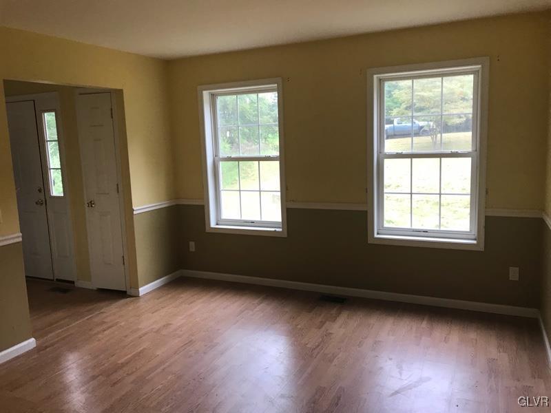 2512 Valley View Acres Road Stroudsburg, PA 18360 - Photo 2 of 23 an empty room with wooden floor and windows