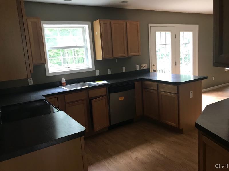 2512 Valley View Acres Road Stroudsburg, PA 18360 - Photo 4 of 23 a kitchen with a sink a window and cabinets