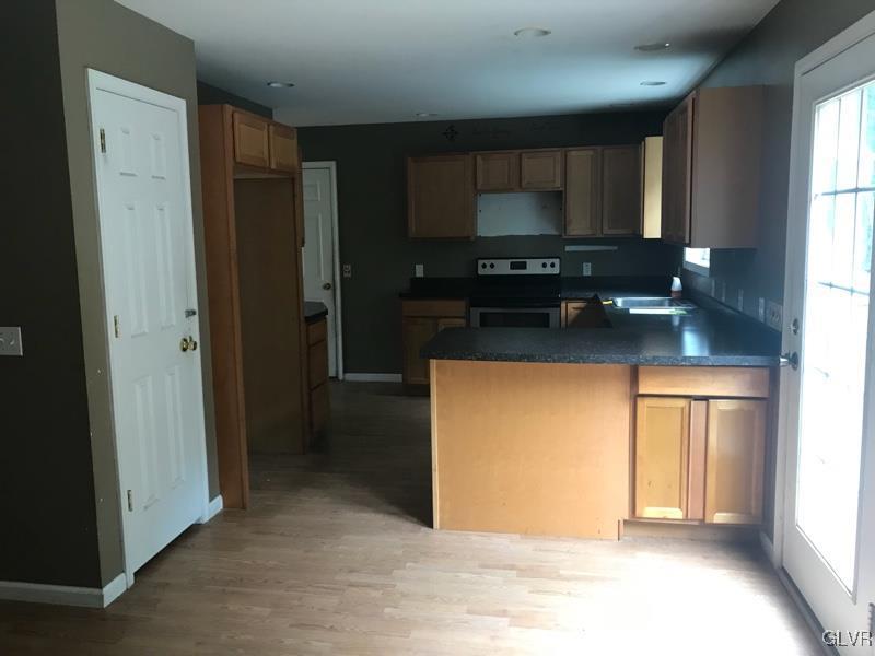 2512 Valley View Acres Road Stroudsburg, PA 18360 - Photo 5 of 23 a kitchen with stainless steel appliances granite countertop a refrigerator and a sink