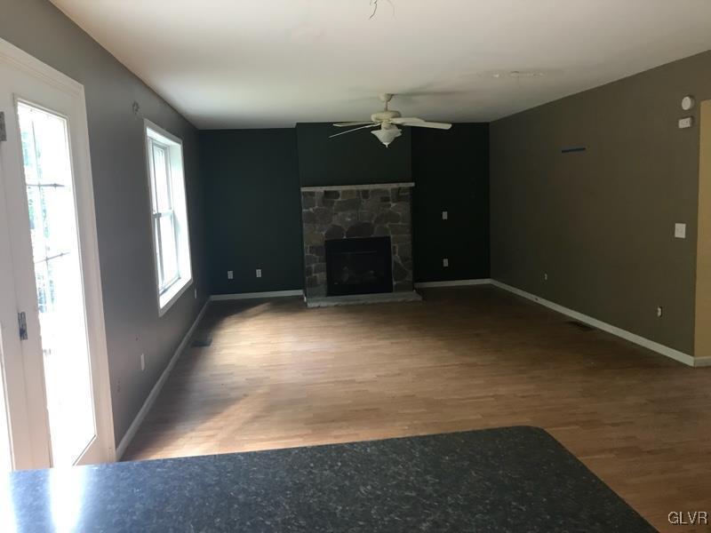2512 Valley View Acres Road Stroudsburg, PA 18360 - Photo 8 of 23 an empty room with windows and fireplace