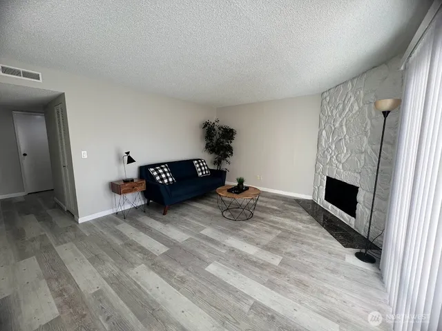 a view of a livingroom with a fireplace