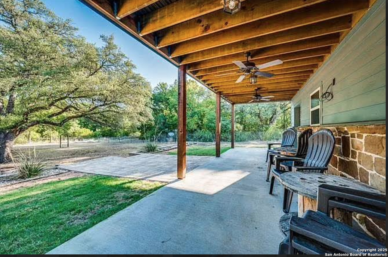 416 Coxs Oak Valley Road Waco, TX 76705 - Photo 19 of 24 a patio with glass top table and chairs