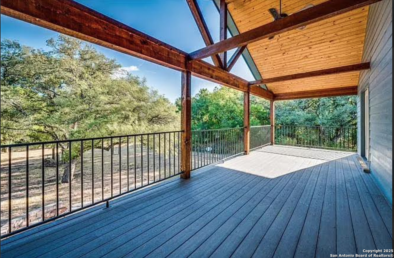 416 Coxs Oak Valley Road Waco, TX 76705 - Photo 3 of 24 a view of an empty room with wooden floor and a window