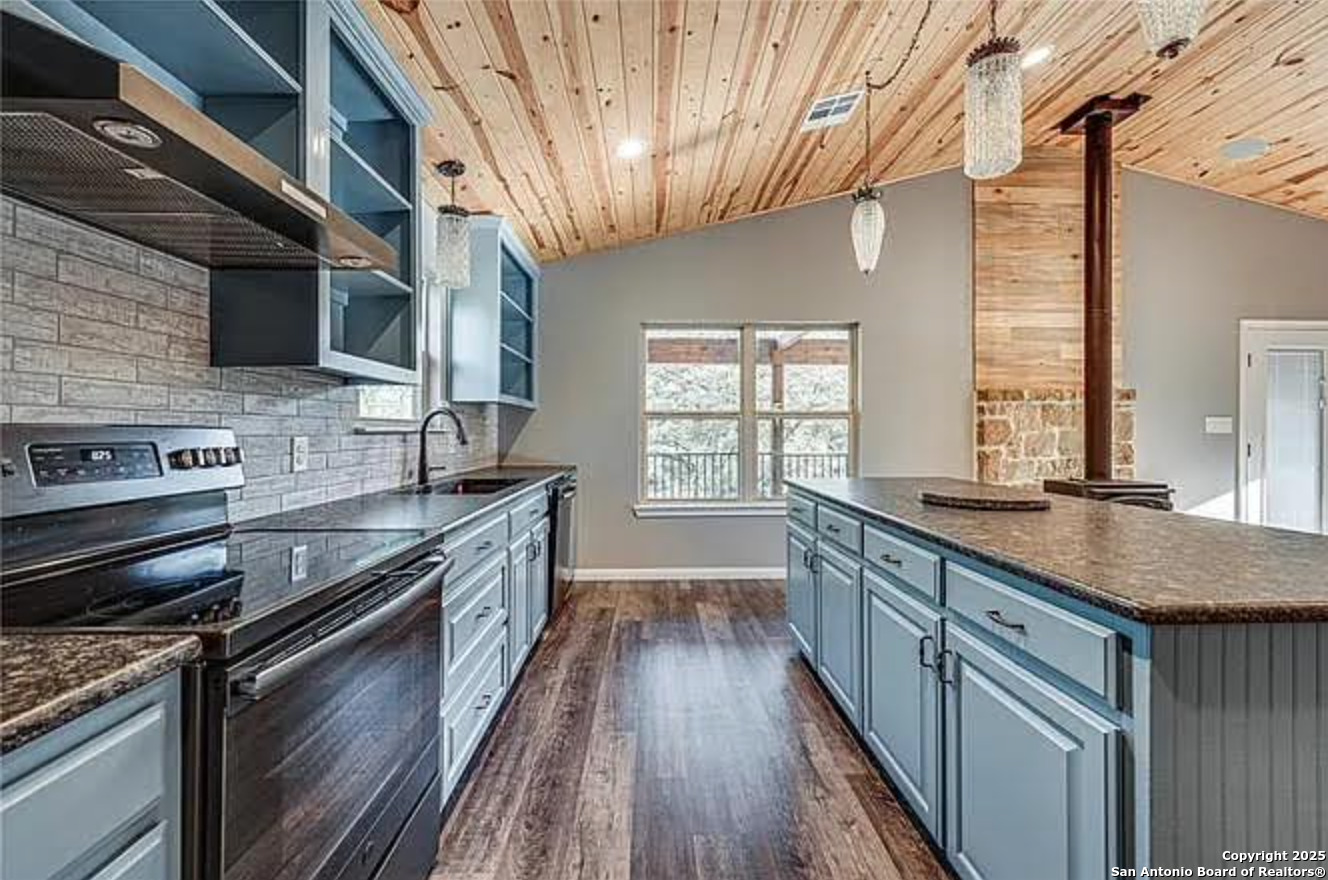 416 Coxs Oak Valley Road Waco, TX 76705 - Photo 4 of 24 a kitchen with stainless steel appliances granite countertop a stove and a sink