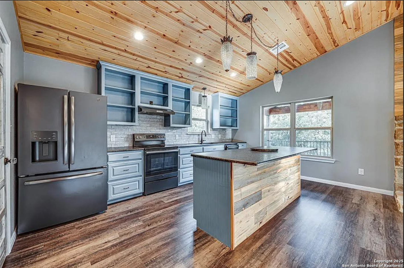 416 Coxs Oak Valley Road Waco, TX 76705 - Photo 6 of 24 a kitchen with stainless steel appliances kitchen island granite countertop a refrigerator stove and oven