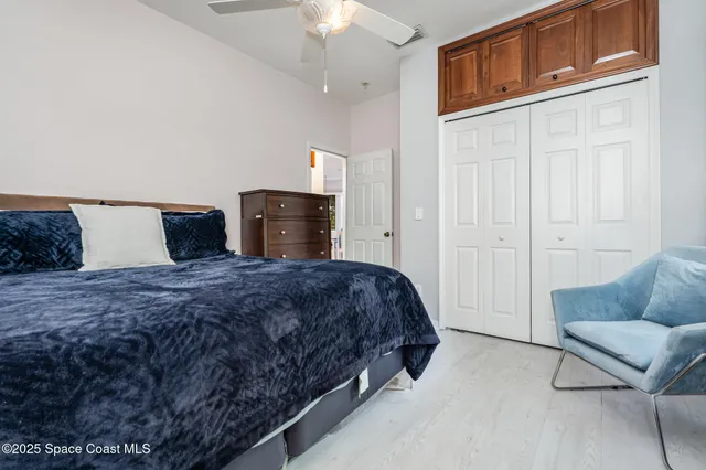 a bedroom with a bed and a couch