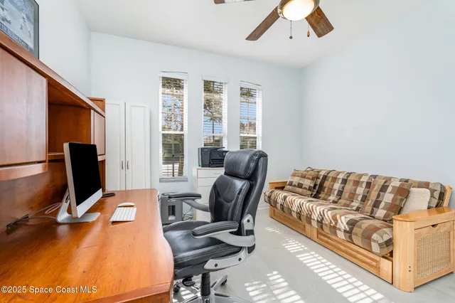 a bedroom with furniture and a window