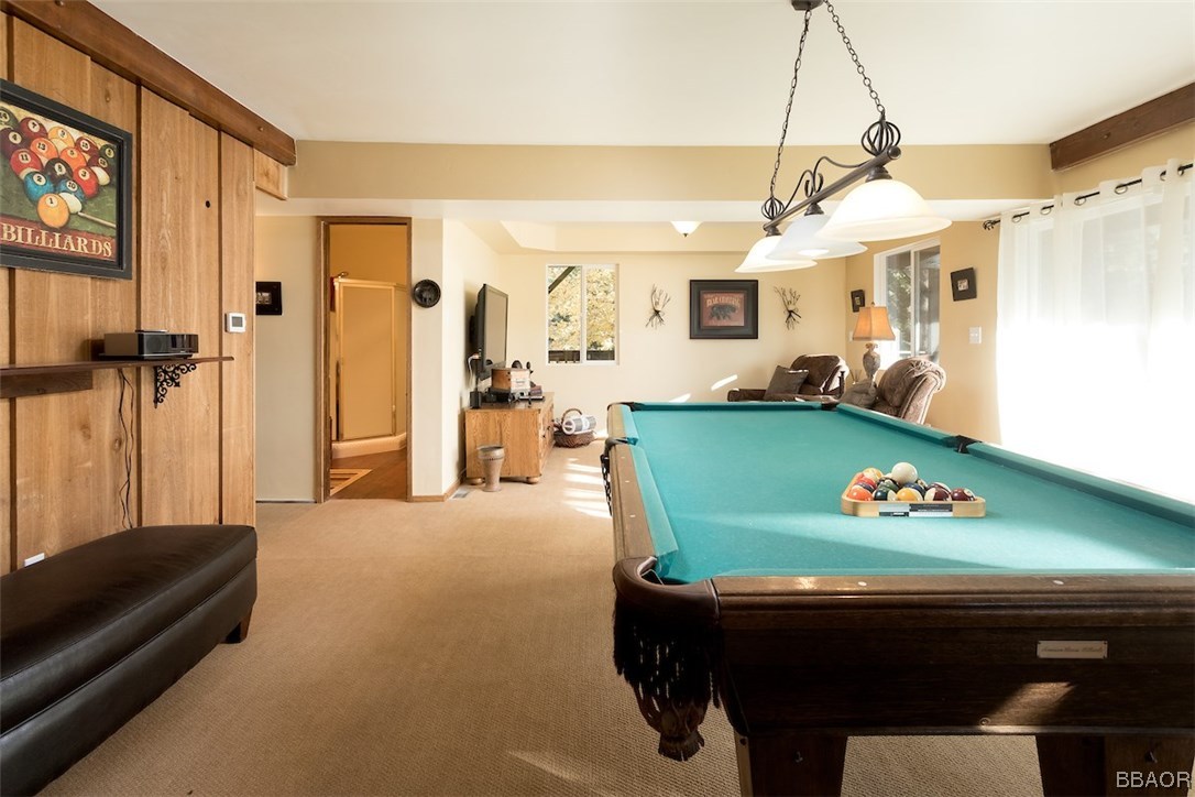 738 Silver Tip Drive Big Bear Lake, CA 92315 - Photo 17 of 30 a room with pool table and a chandelier