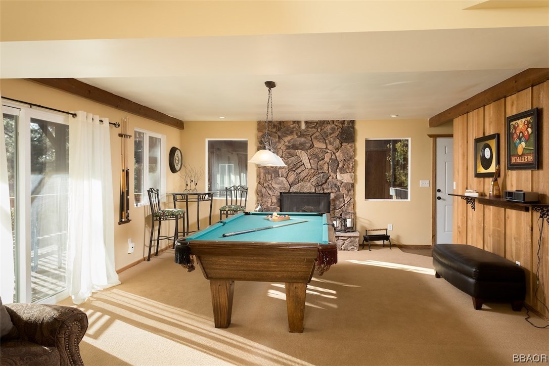 738 Silver Tip Drive Big Bear Lake, CA 92315 - Photo 18 of 30 a living room with furniture a flat screen tv and a large window