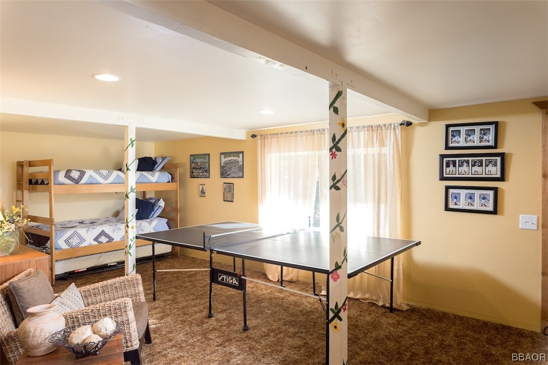 738 Silver Tip Drive Big Bear Lake, CA 92315 - Photo 23 of 30 a living room with furniture and a table