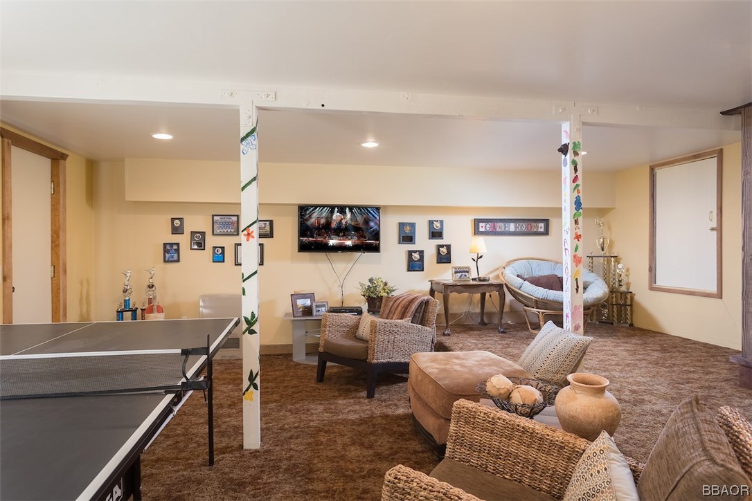 738 Silver Tip Drive Big Bear Lake, CA 92315 - Photo 25 of 30 a living room with furniture and a flat screen tv