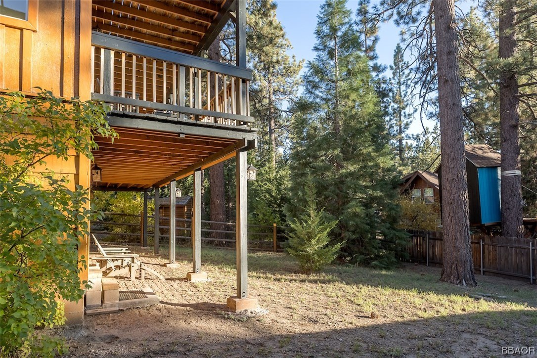 738 Silver Tip Drive Big Bear Lake, CA 92315 - Photo 28 of 30 a backyard of a house with table and chairs