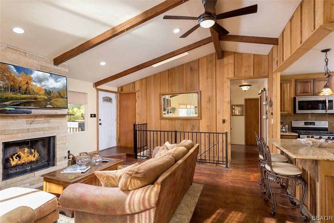 738 Silver Tip Drive Big Bear Lake, CA 92315 - Photo 5 of 30 a living room with furniture a flat screen tv and a fireplace