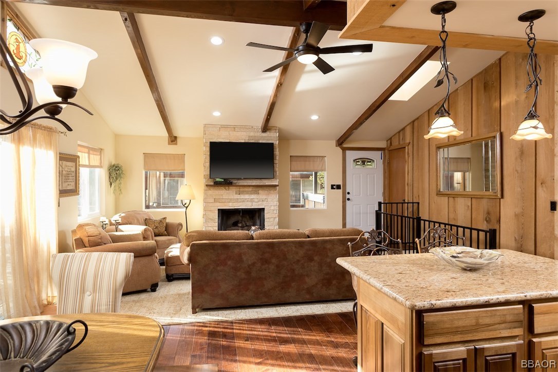 738 Silver Tip Drive Big Bear Lake, CA 92315 - Photo 8 of 30 a living room with furniture a fireplace and a flat screen tv
