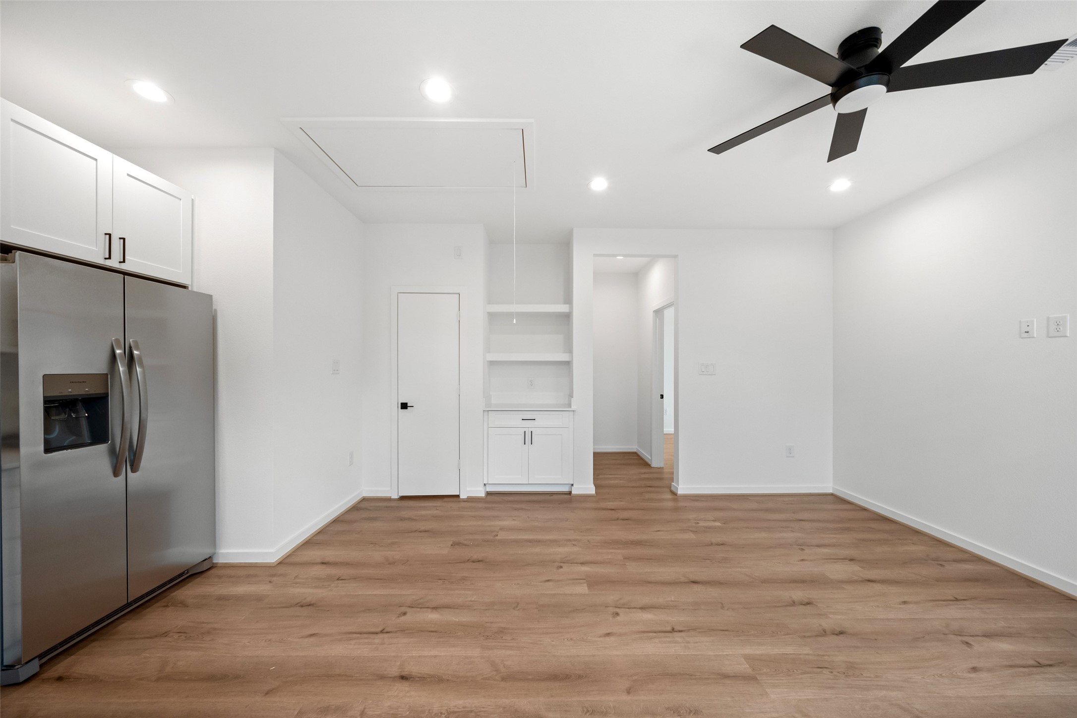 1408 Enid Street Houston, TX 77009 - Photo 19 of 50 a view of empty room with wooden floor and window