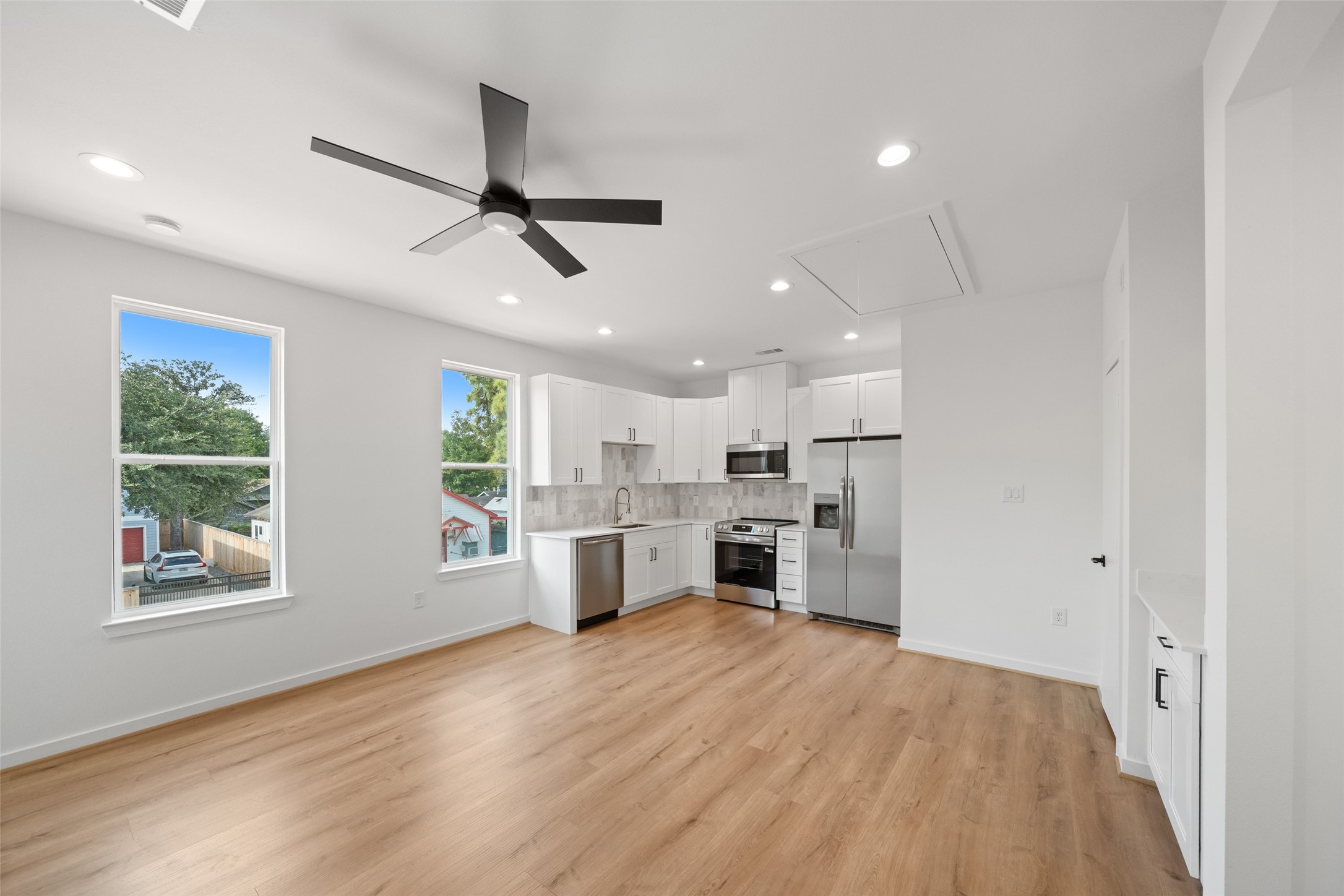 1408 Enid Street Houston, TX 77009 - Photo 21 of 50 a view of kitchen with sink microwave and refrigerator