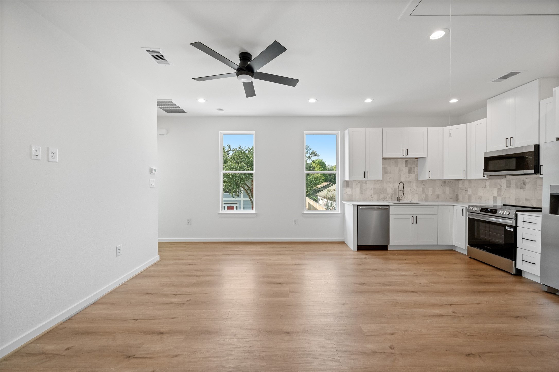 1408 Enid Street Houston, TX 77009 - Photo 24 of 50 a view of a kitchen with electric appliances and cabinets