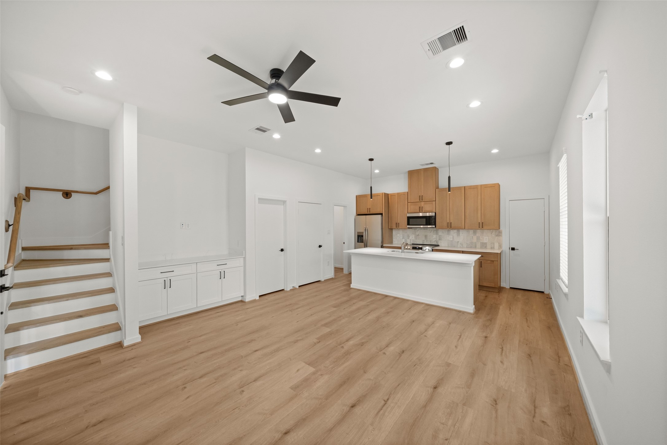 1408 Enid Street Houston, TX 77009 - Photo 26 of 50 a view of a kitchen with wooden floor