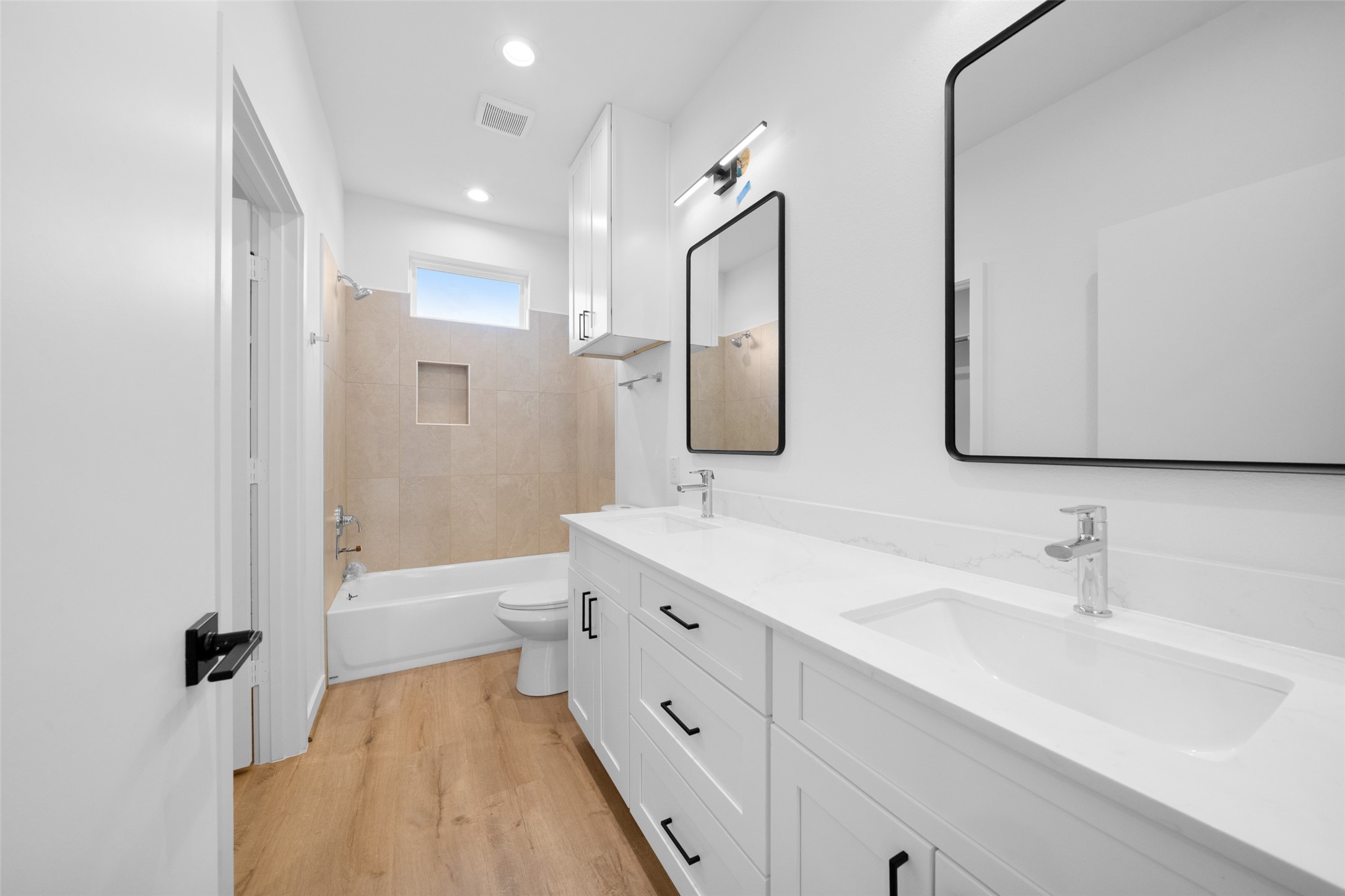 1408 Enid Street Houston, TX 77009 - Photo 42 of 50 a bathroom with a double vanity sink mirror double and bathtub