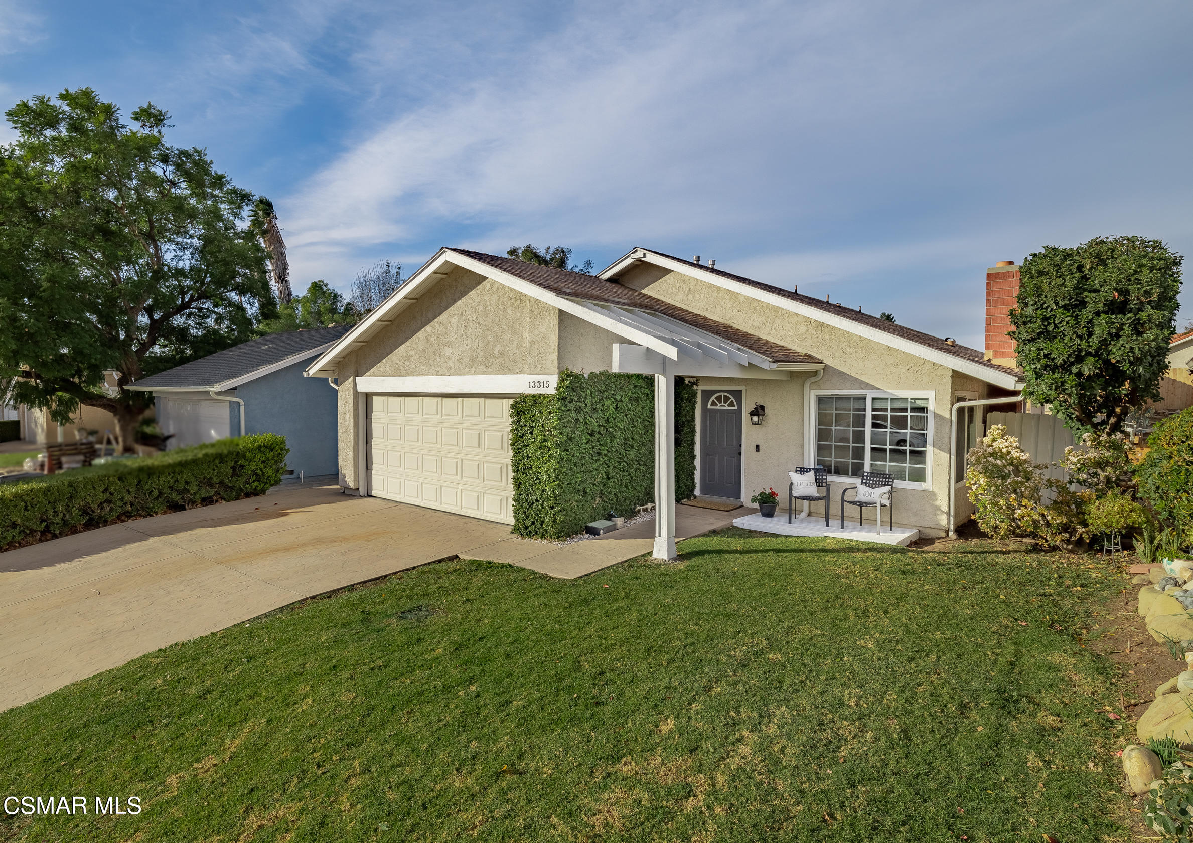 13315 Laurelhurst Road Moorpark, CA 93021 - Photo 1 of 1 a front view of a house with garden and porch