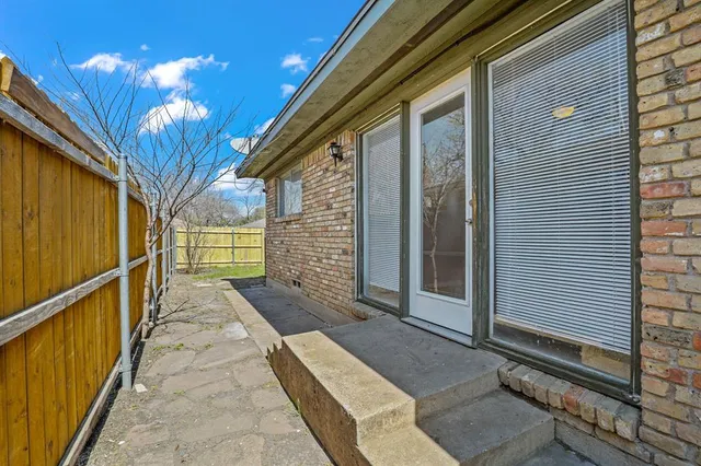 a view of a porch with wooden floor and stairs