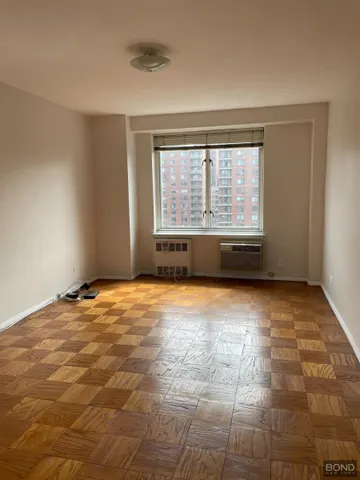 a view of an empty room with a window