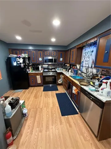 a bed room with a bed and a television