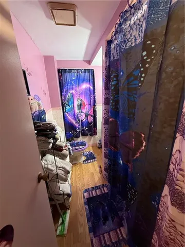 a bedroom with furniture and a mirror