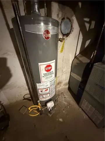 a view of garage with a car parked in it