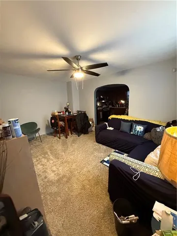 a kitchen with kitchen island a stove and a refrigerator