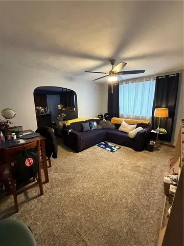 a large kitchen with stainless steel appliances lots of counter space and a sink