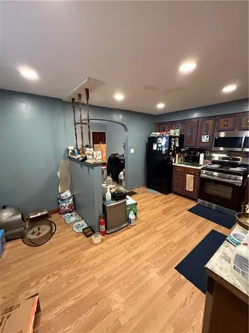 a bedroom with furniture and mirror