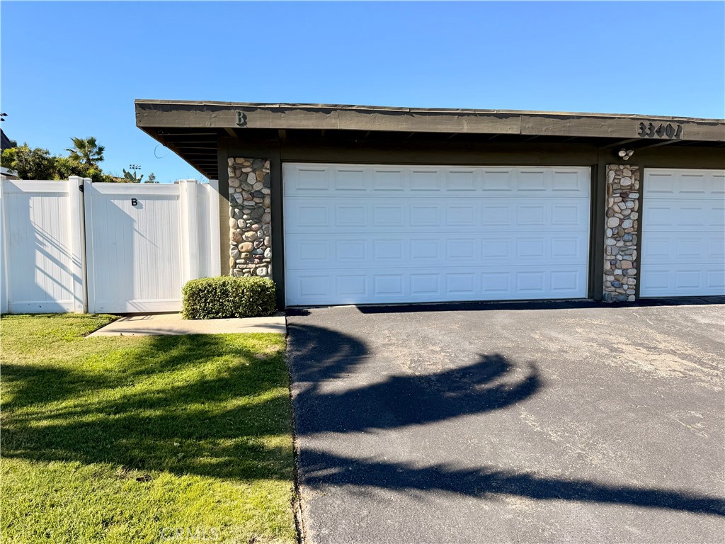 33401 Nottingham Way, Unit B Dana Point, CA 92629 - Photo 1 of 1 a wooden door in front of a house