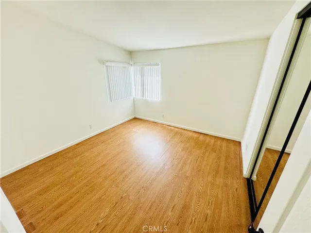 a bathroom with a sink mirror vanity and toilet