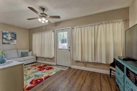 a bedroom with furniture and a window