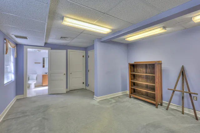 a bathroom with a double vanity sink a shower and a mirror