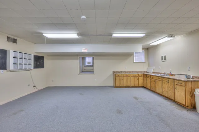 a swimming pool with outdoor seating and yard