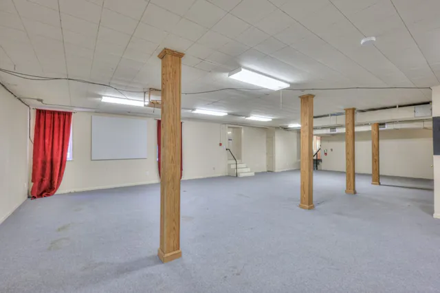 an aerial view of residential houses with outdoor space and street view